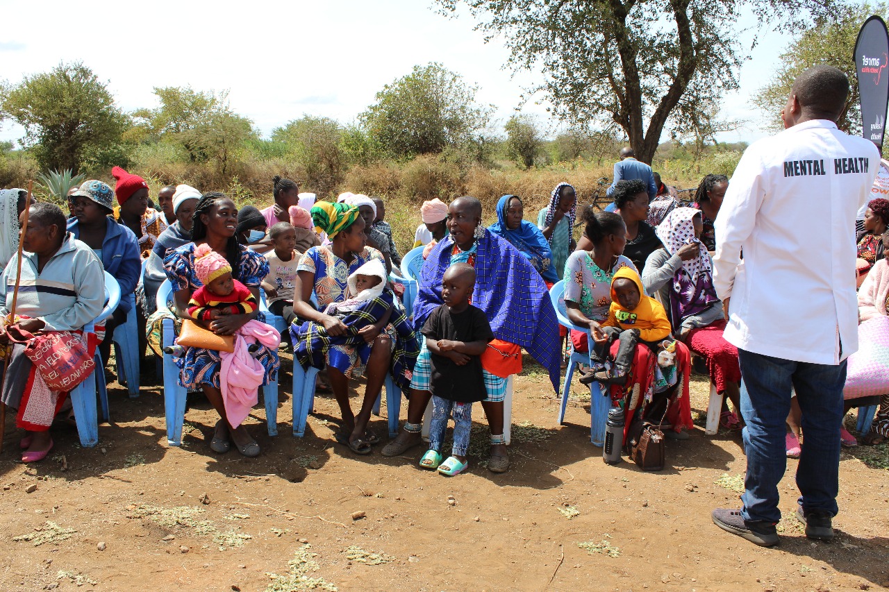 Community members at an outdoor health education session in Kajiado County