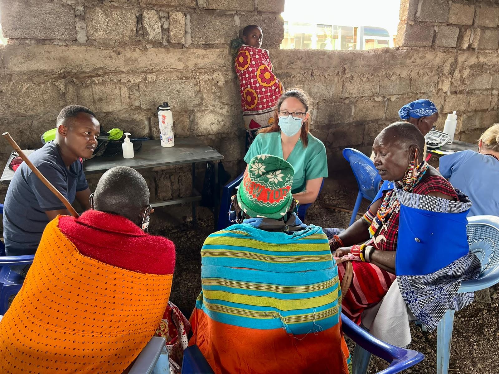 Community members being attended to at a medical outreach