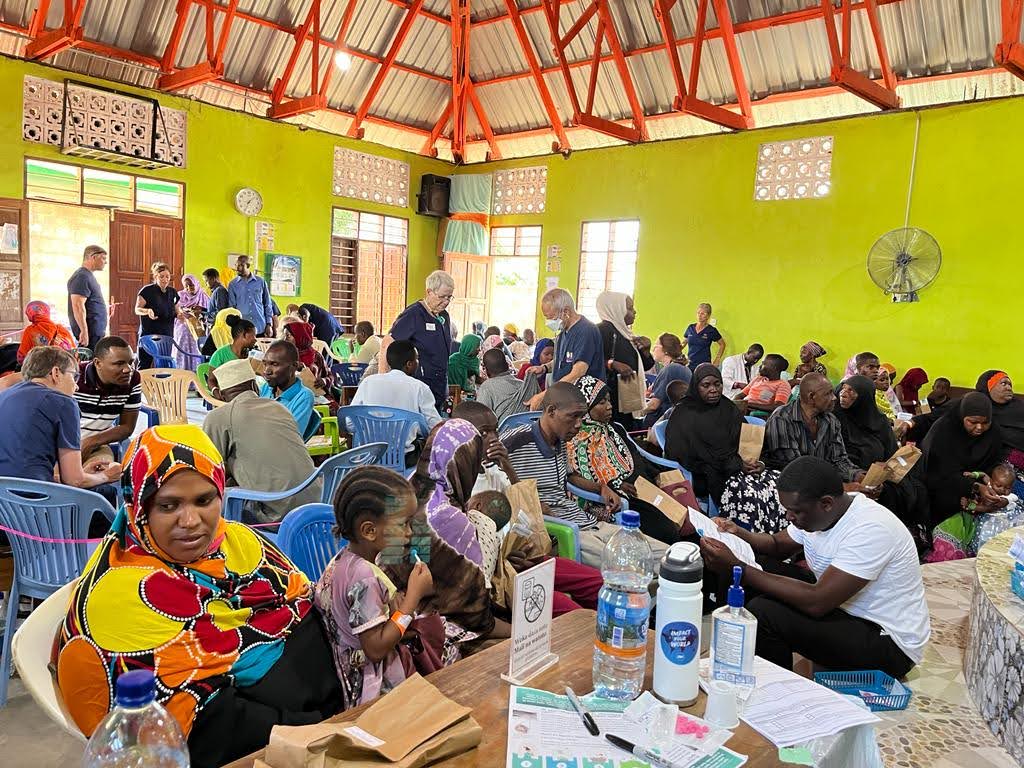 A packed hall of community members at an Entepesi Kenya medical outreach